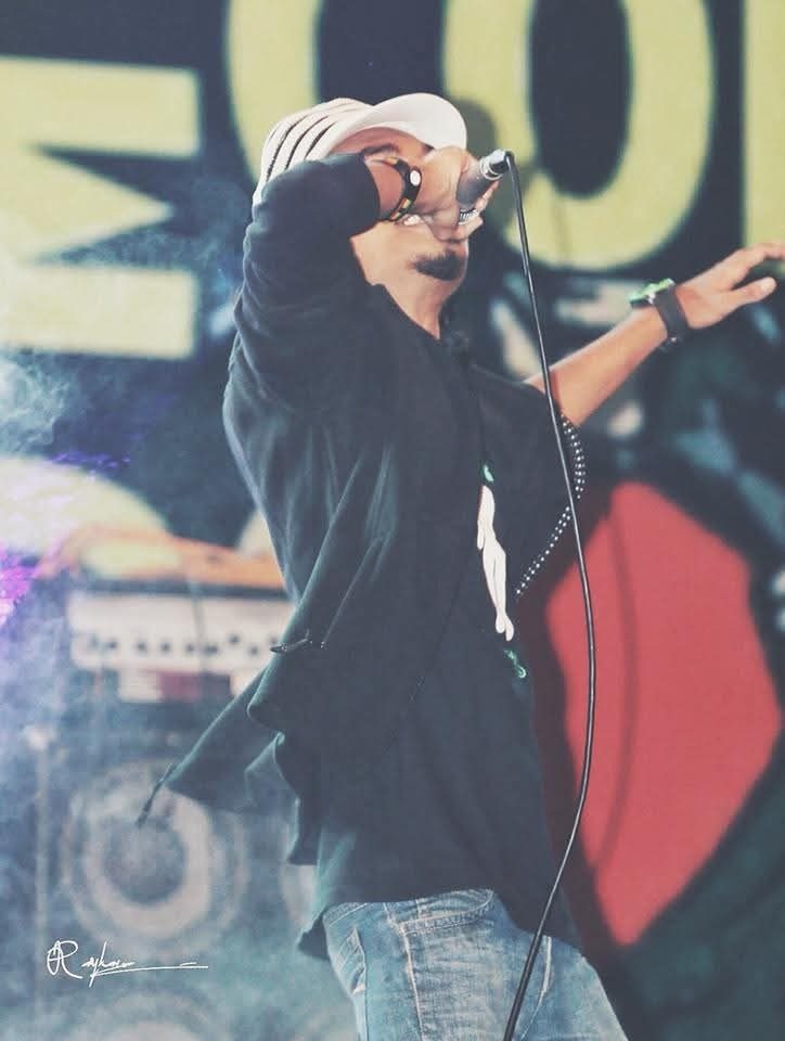 Nizam Rabby performing live with microphone