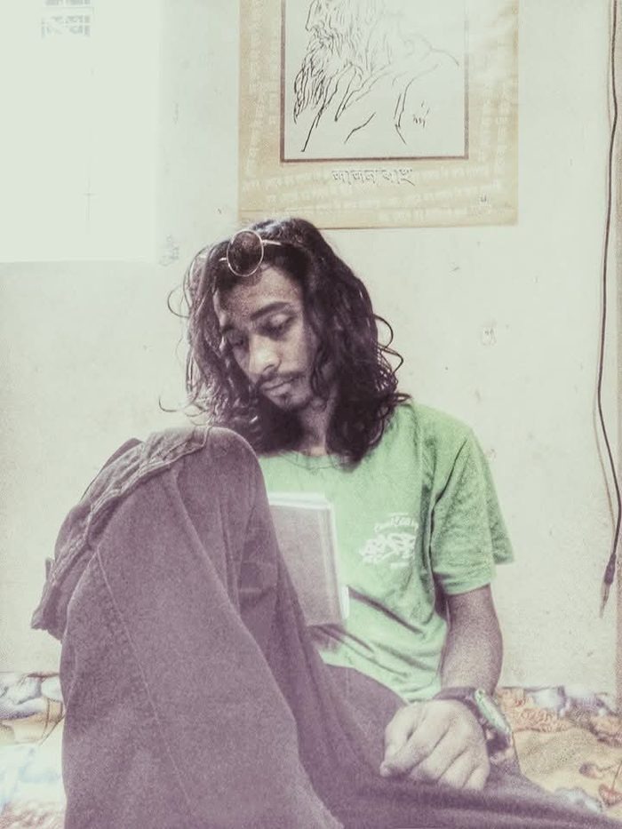 Nizam Rabby reading, candid moment
